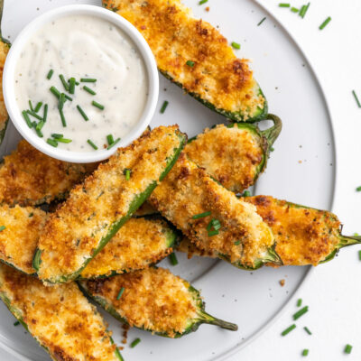 This Air Fryer Jalapeno Poppers recipe combines spicy jalapenos with a creamy and cheesy filling, topped off with a little crunch for a delicious appetizer or snack!