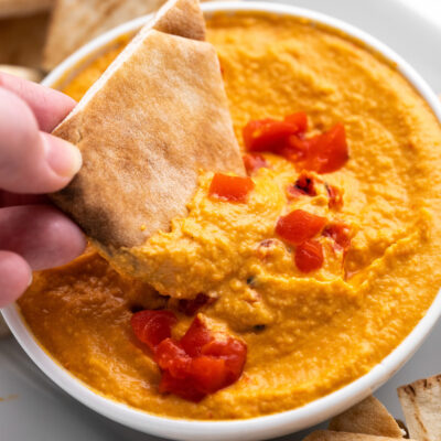 This boldly flavored Roasted Red Pepper Hummus is smooth, creamy and makes a scrumptious dip or spread. The best part is that it all comes together in less than 10 minutes!