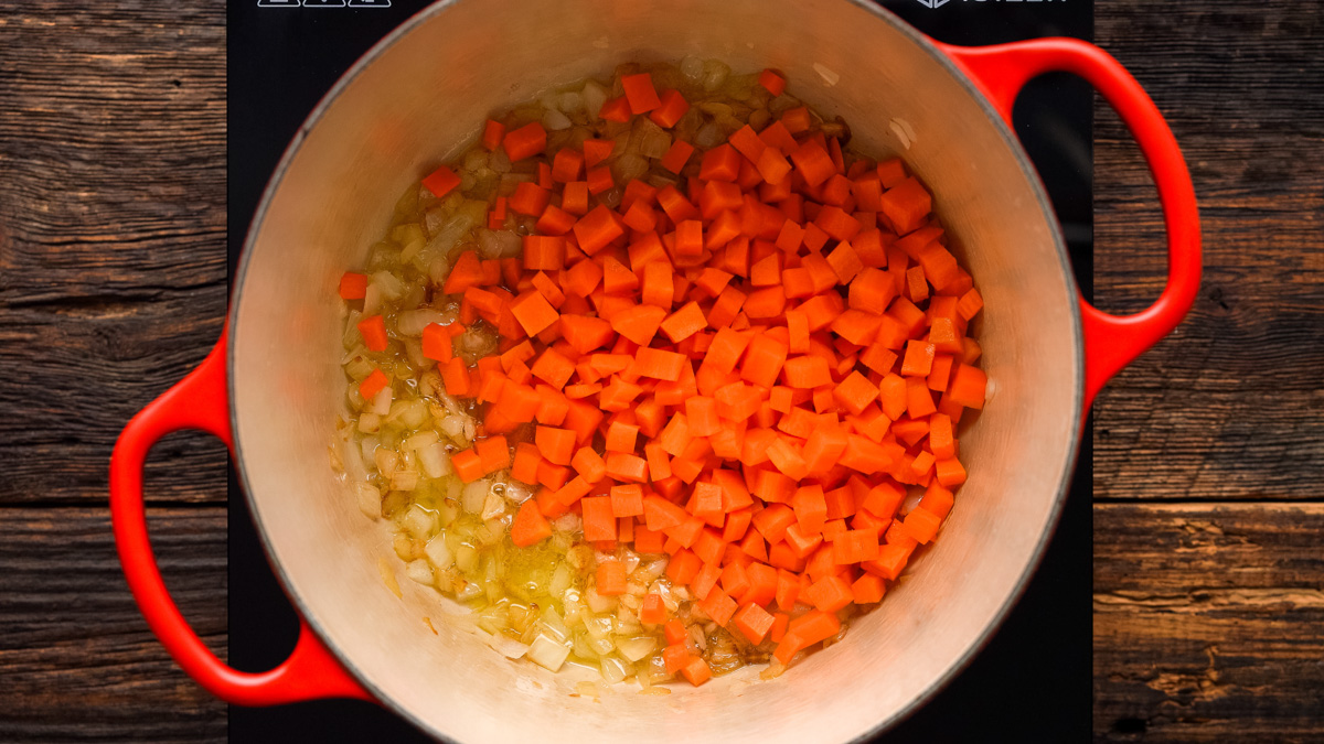 Carrots added into the Dutch oven.