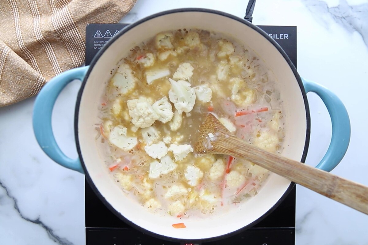 Cauliflower added to the pot with the other ingredients.
