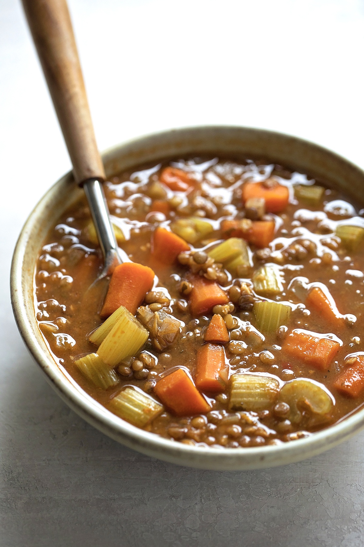 Lentil soup with vegetables in a bowl.