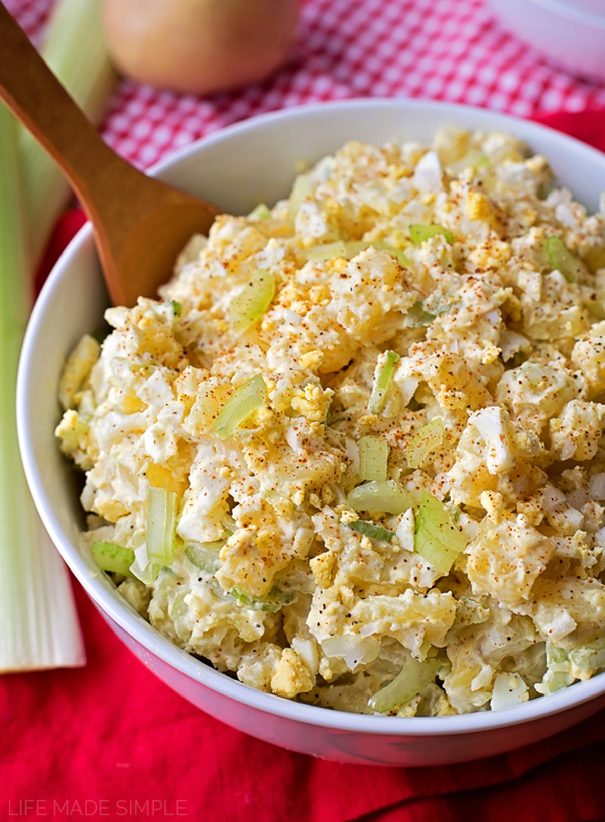 A white bowl served with Mom's classic potato salad.