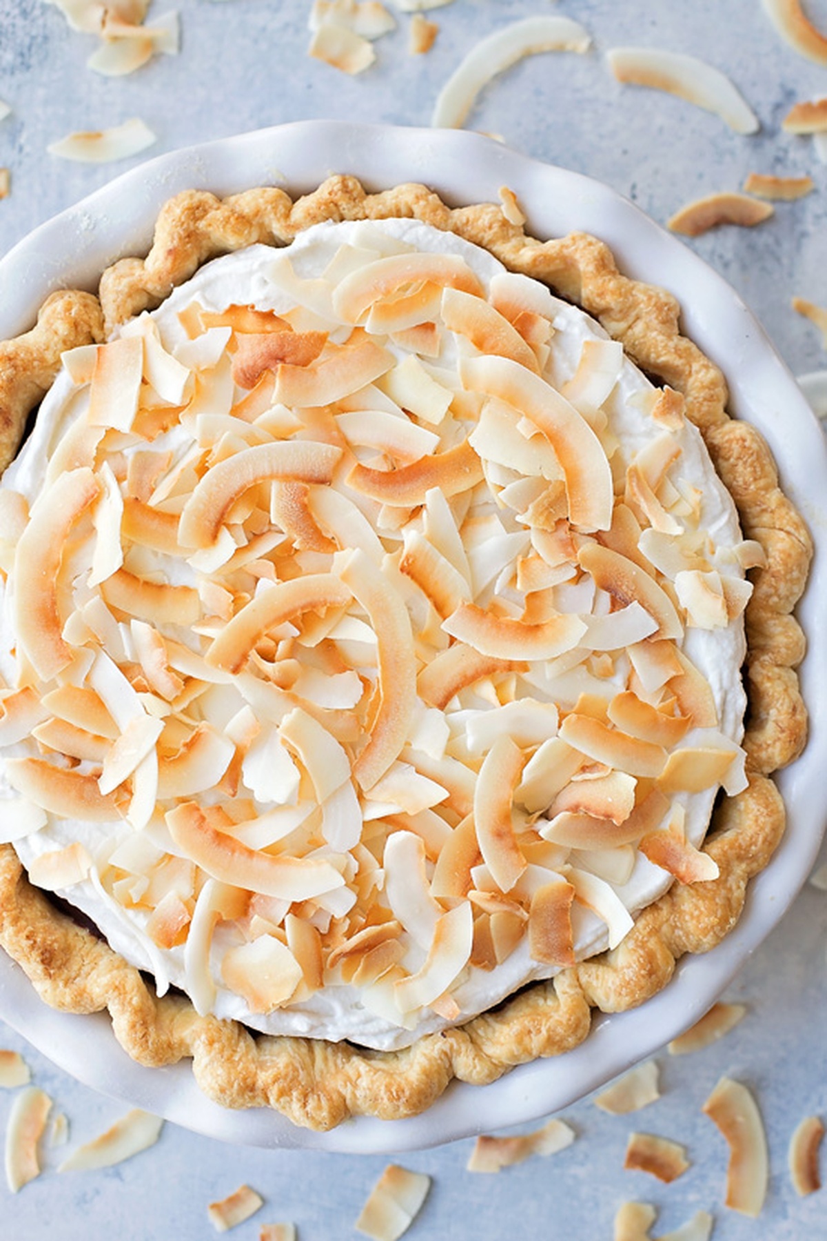 Whole chocolate coconut pie topped with toasted coconut flakes.