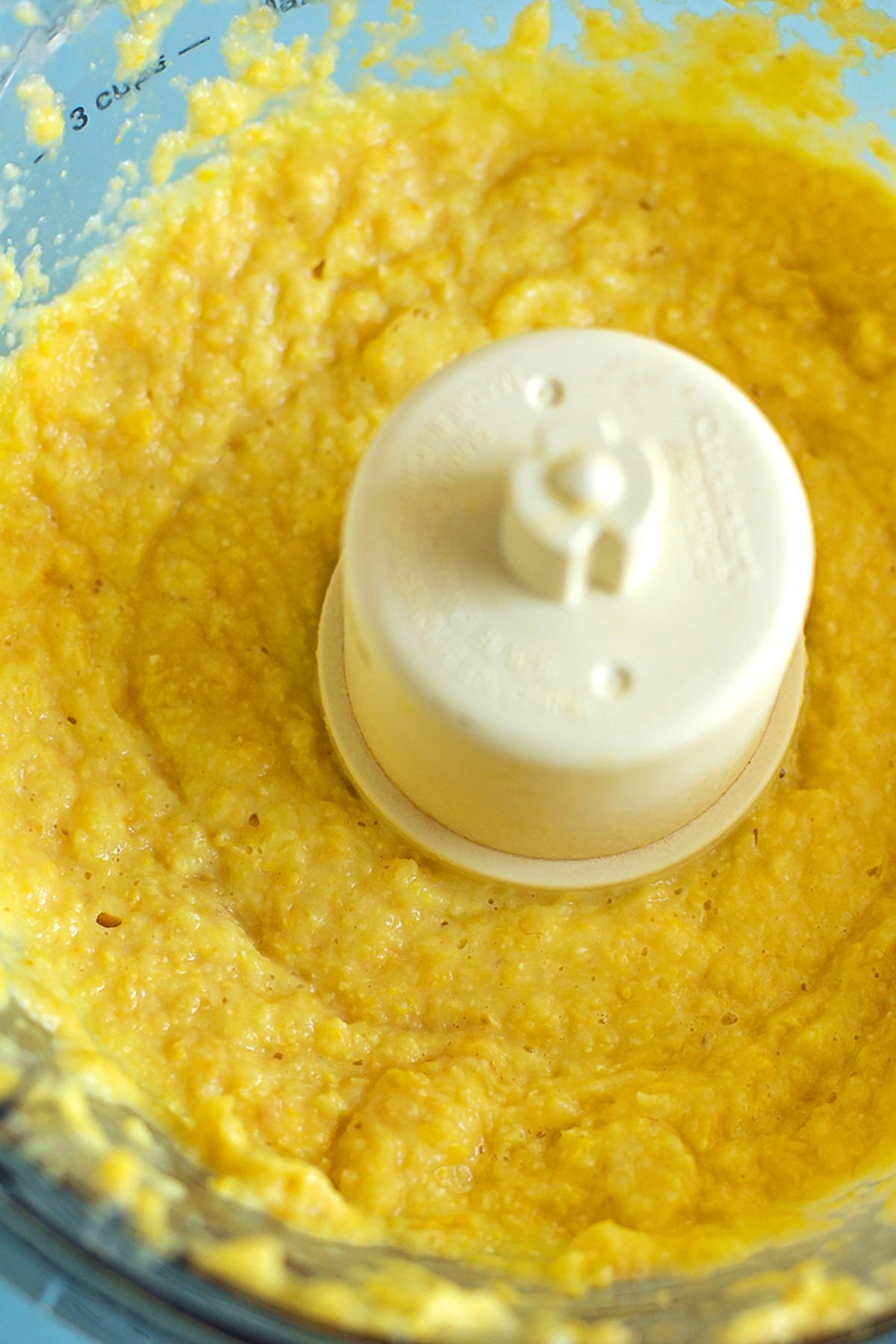 Pureed corn mixture in a food processor.