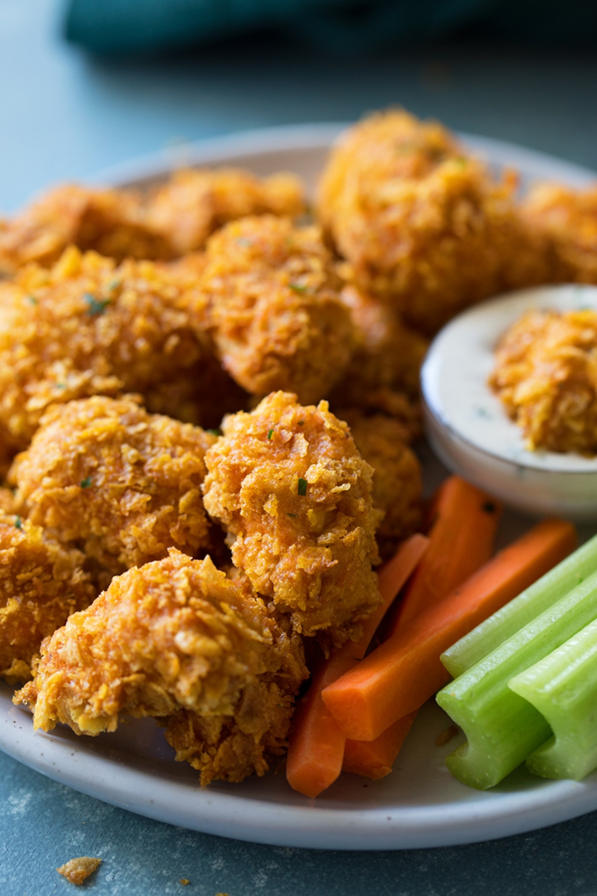 Plate of Buffalo chicken nuggets with dipping sauce.