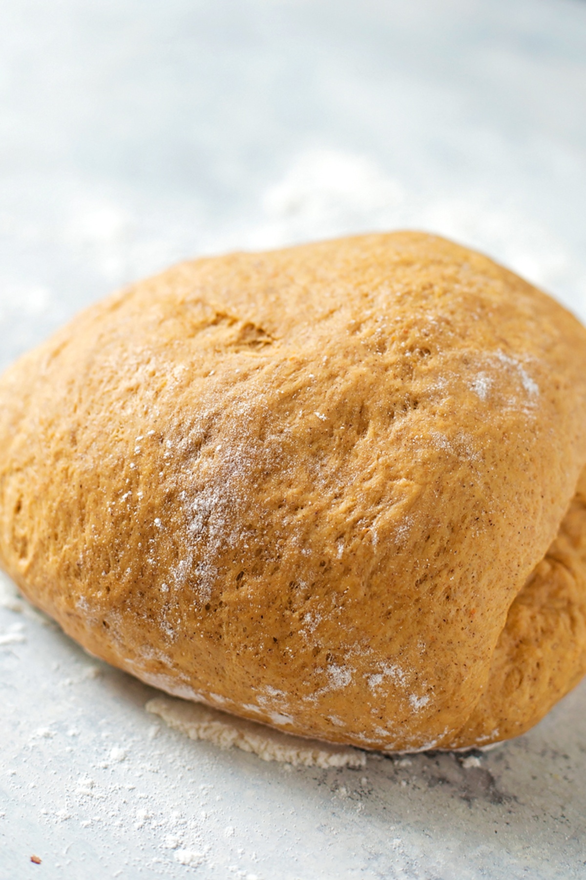  A dough ball on a floured surface.