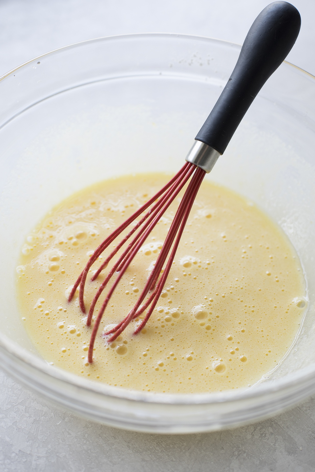 Bowl of whisked egg mixture.