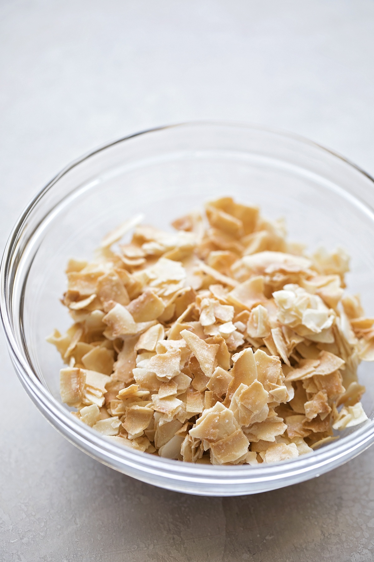 Bowl of toasted coconut flakes.