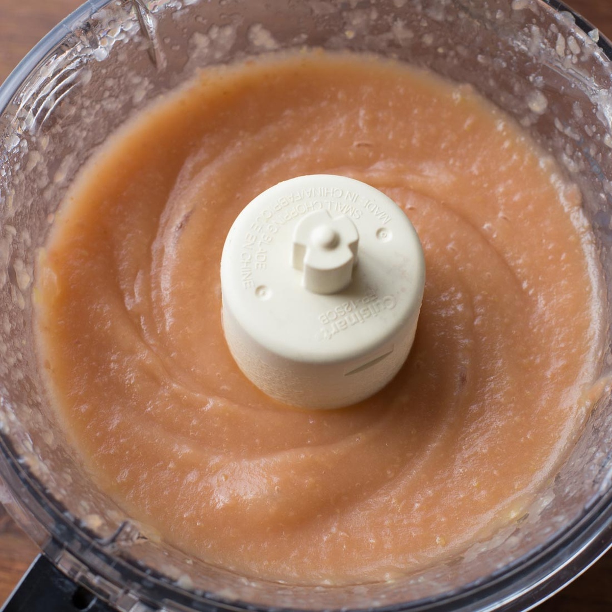 Smooth, freshly made applesauce in a food processor.