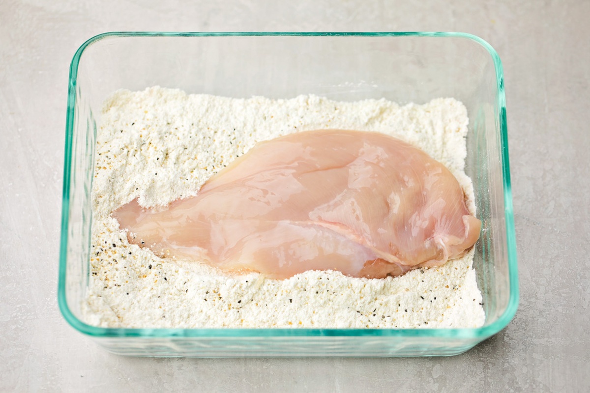 Chicken breast in flour mixture.