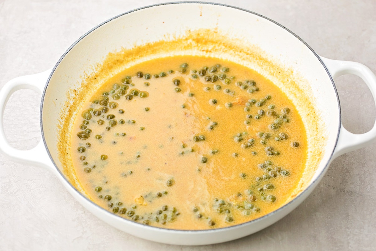 Sauce with capers in skillet.