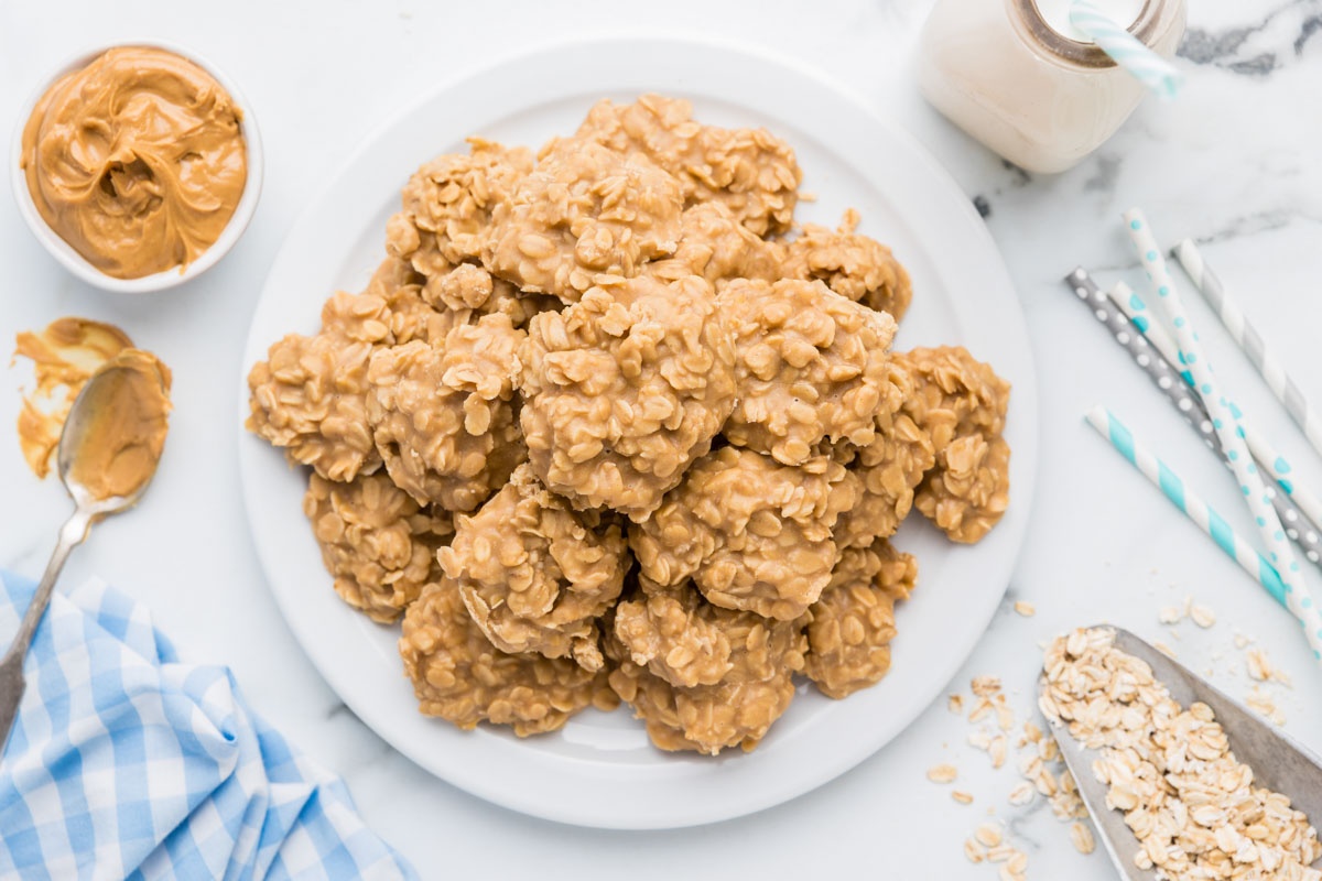 Pile of no bake oatmeal peanut butter cookies on a plate.