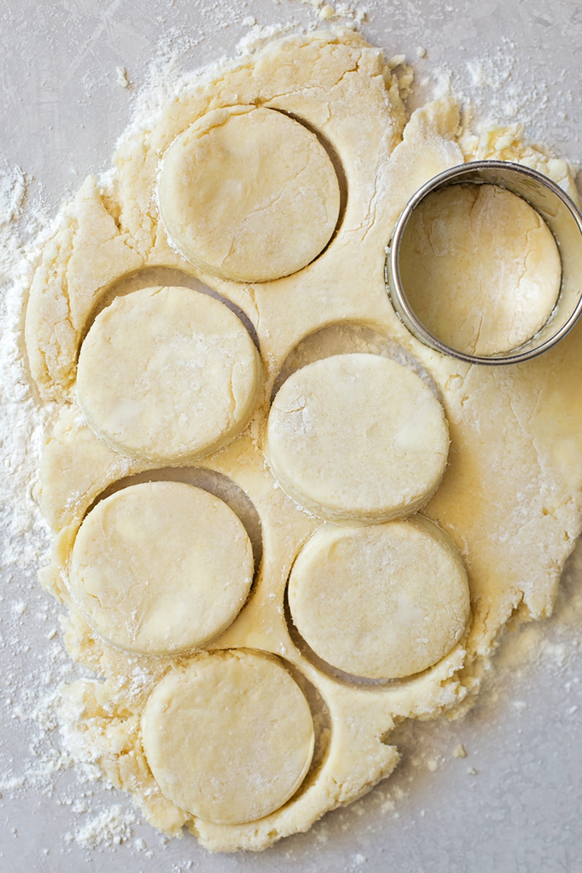 Cut out biscuit dough on a floured surface.