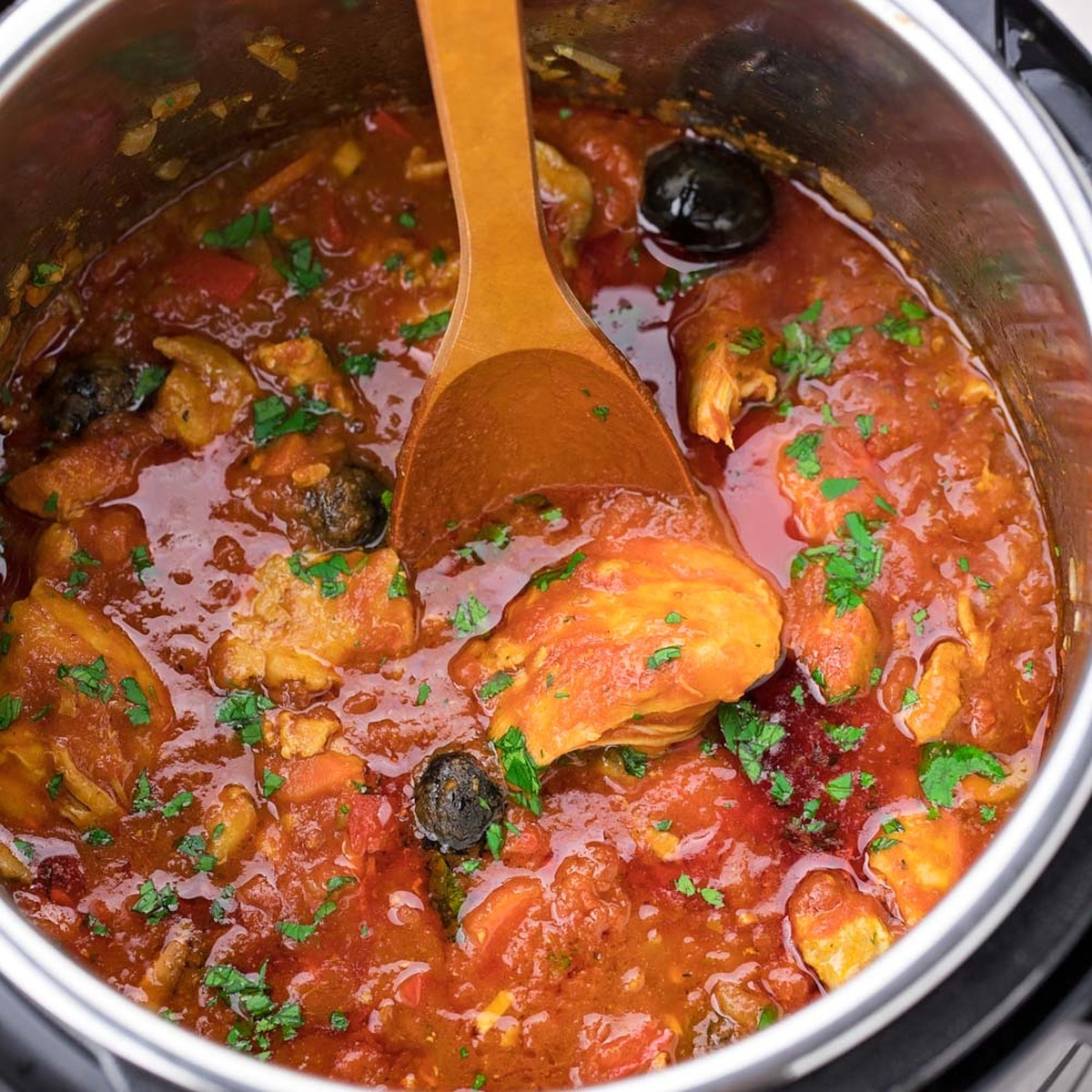 Chicken cacciatore cooking in an Instant Pot.