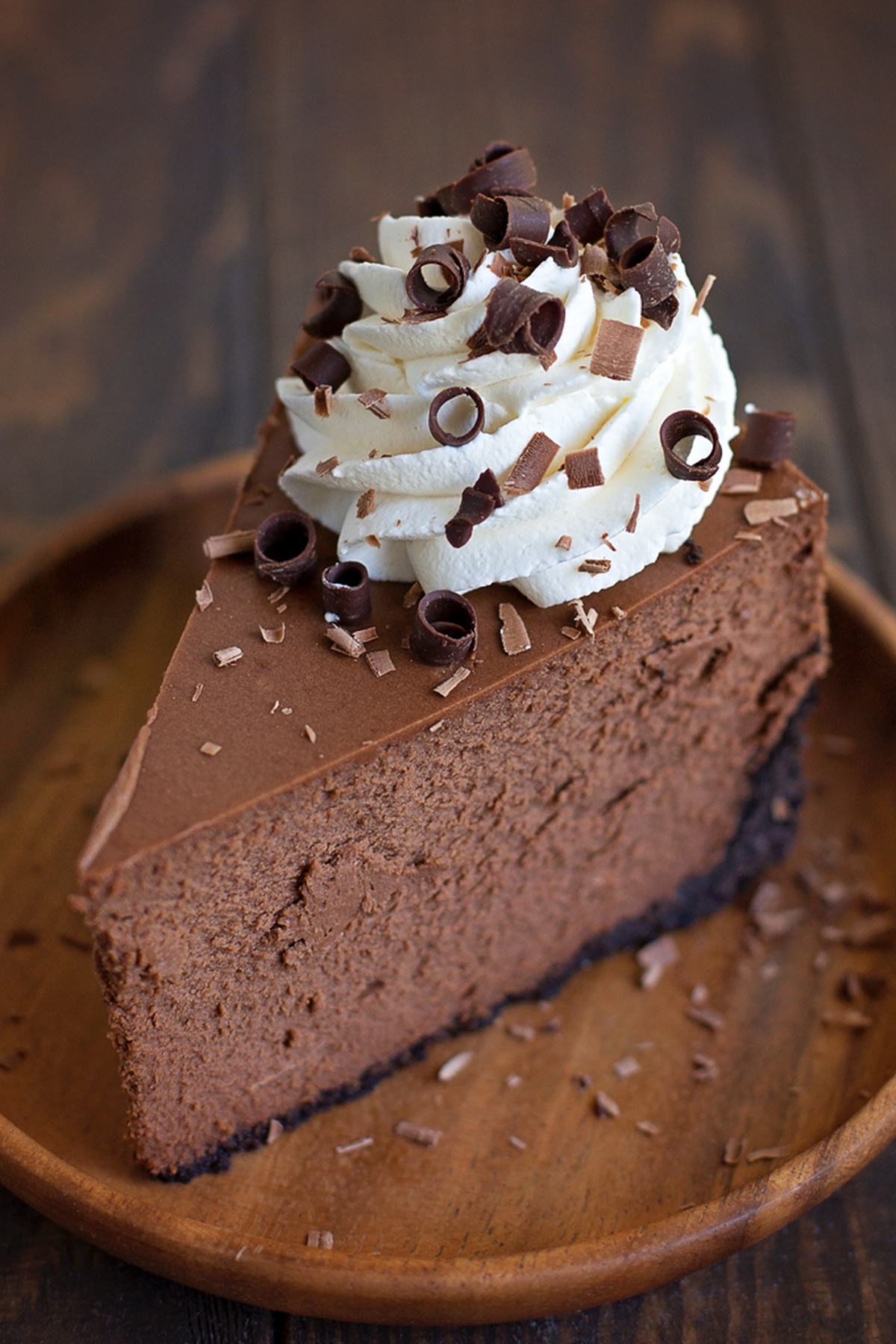 Slice of chocolate cheesecake on a plate.