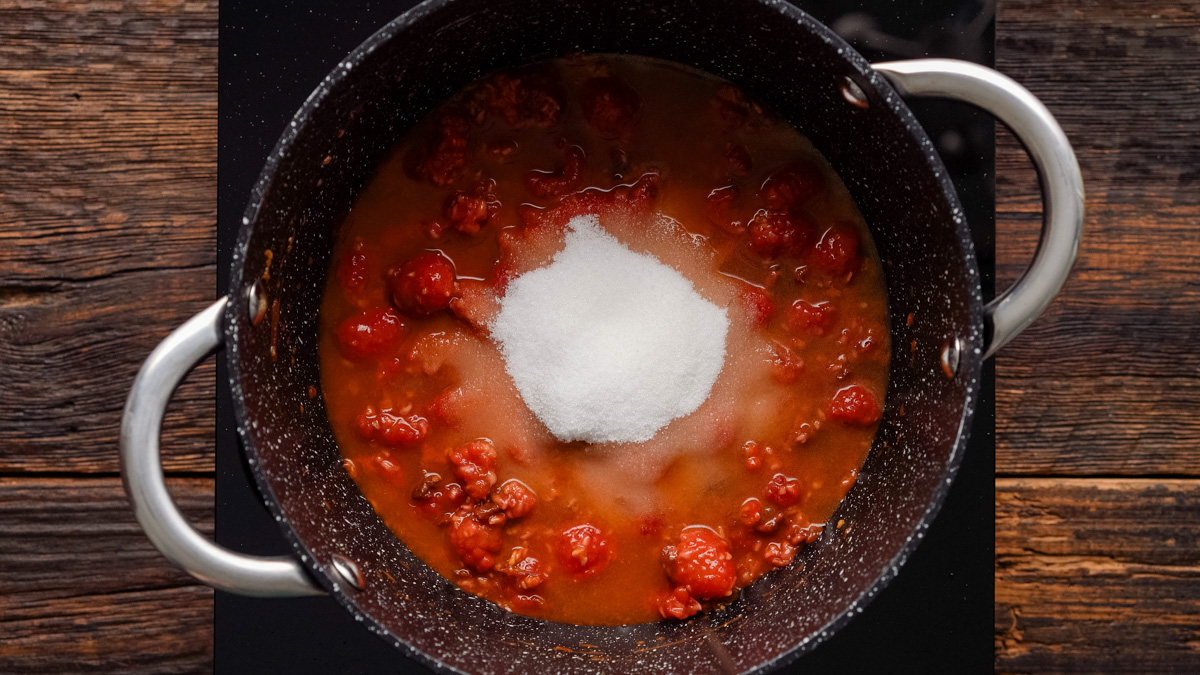 Vinegar, salt, and sugars added into the saucepan. 