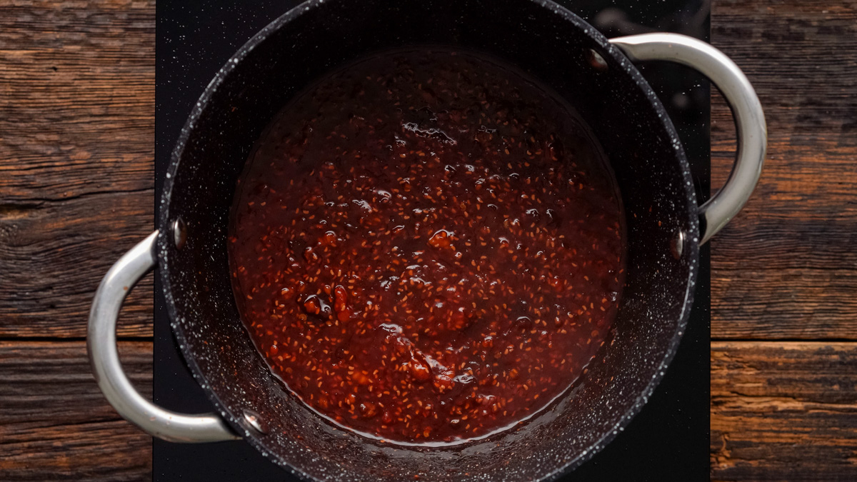 Raspberry chipotle sauce in a saucepan.