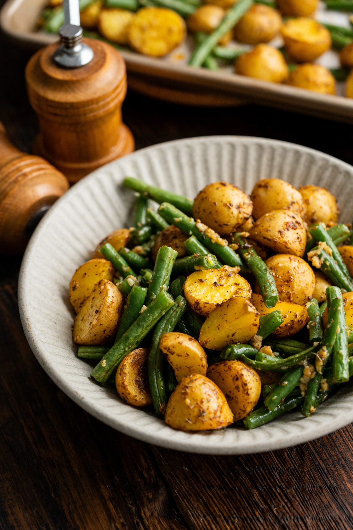 Green beans and potatoes in a white bowl.