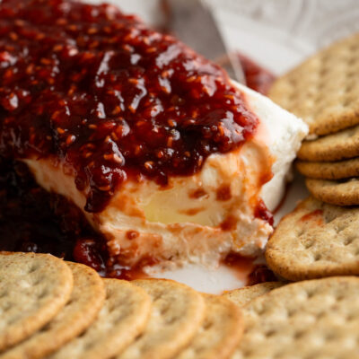 Everyone will rave about this Raspberry Chipotle Cream Cheese Dip! Sweet and Spicy Raspberry Chipotle Sauce poured on top of smooth cream cheese to create the perfect appetizer!