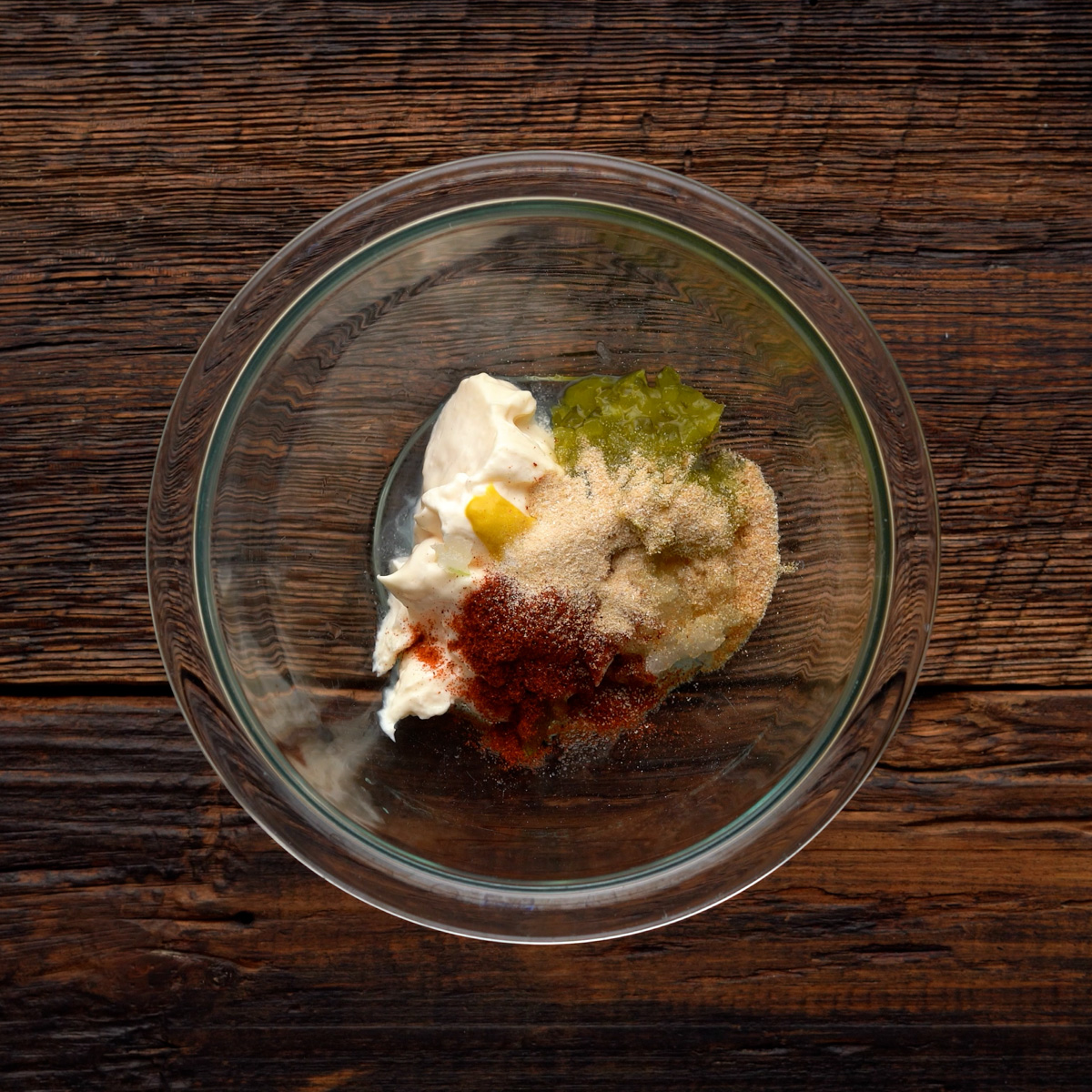 Ingredients for big mac sauce in a glass bowl.