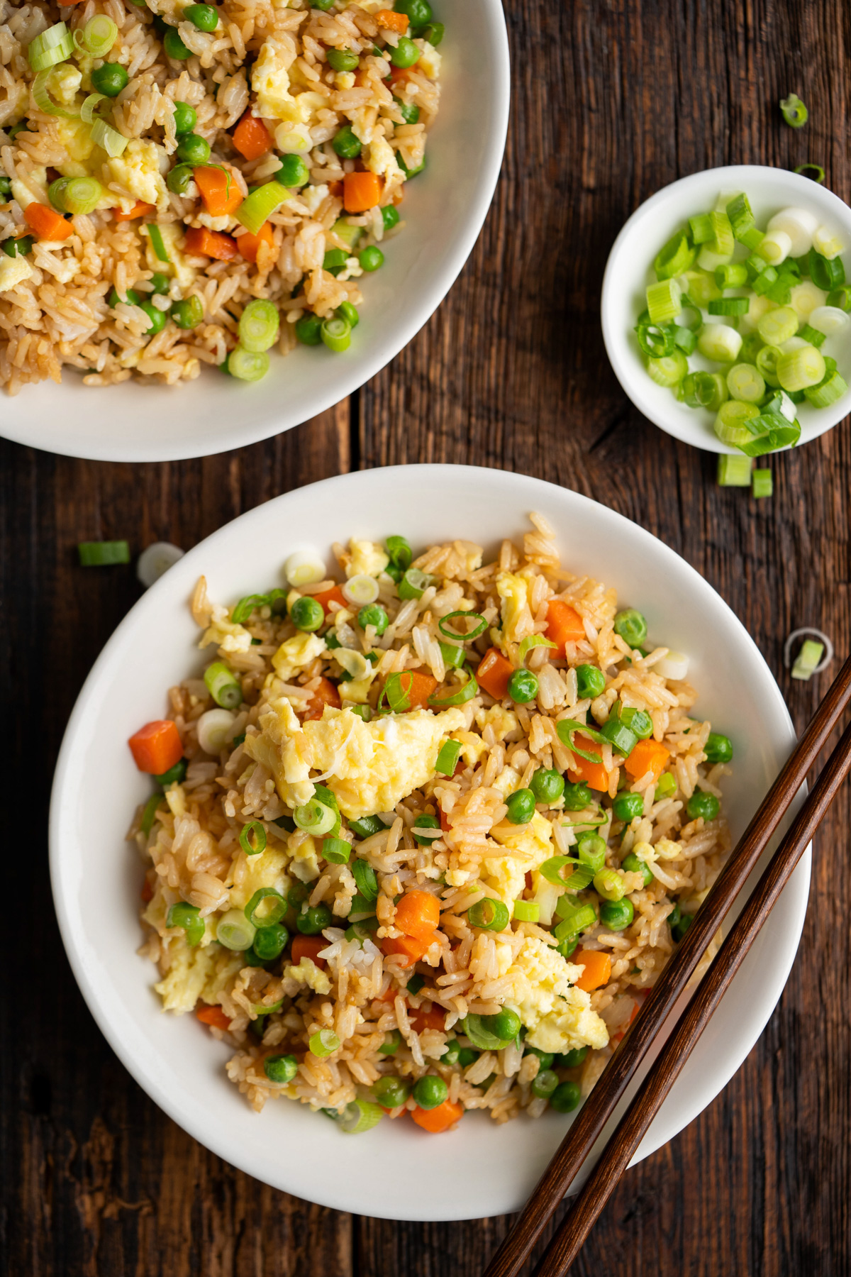 Bowl of Instant pot fried rice with chopsticks on the side.
