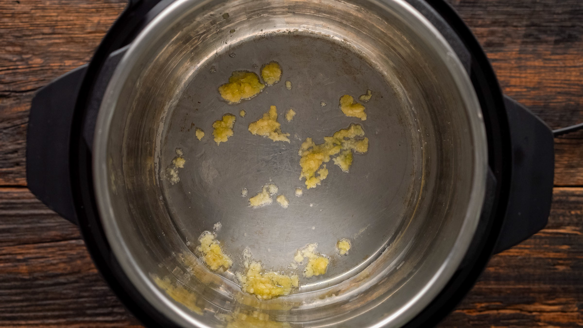 Oil and garlic added to the instant pot.