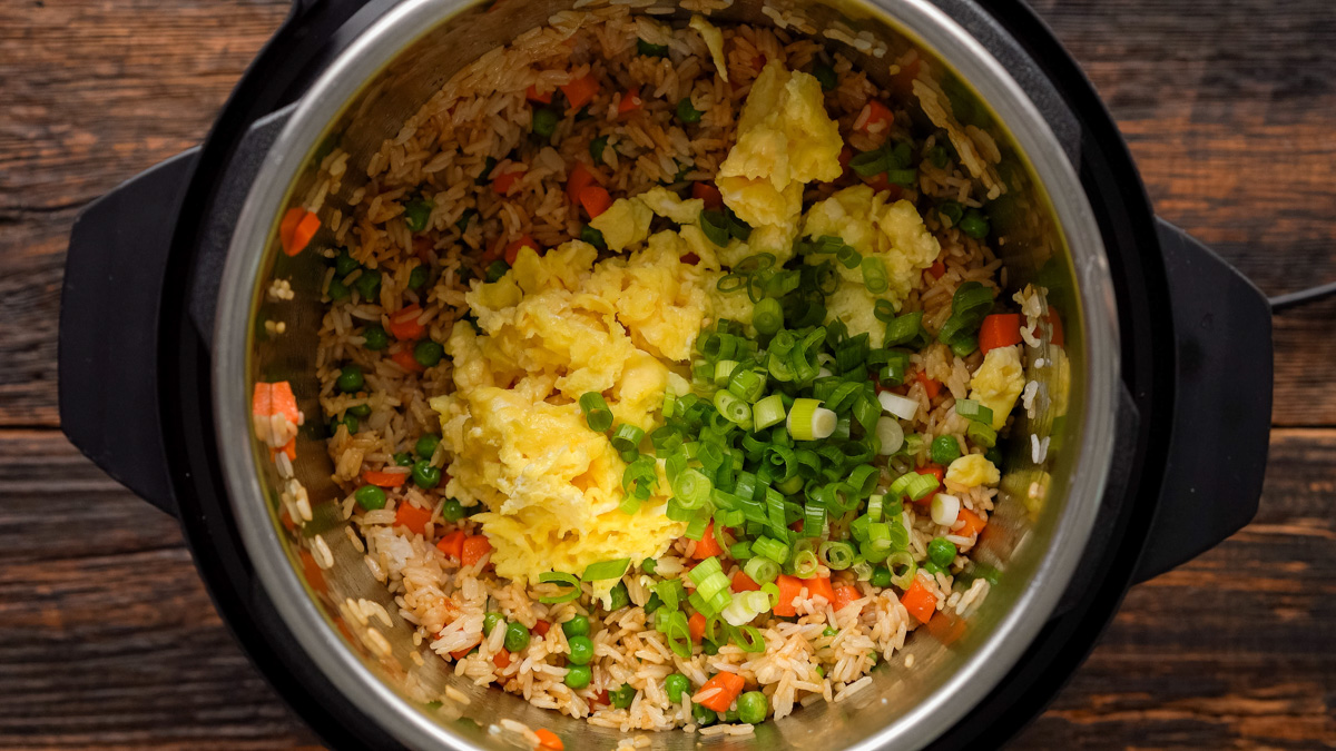 Eggs and green onions added to the rice.