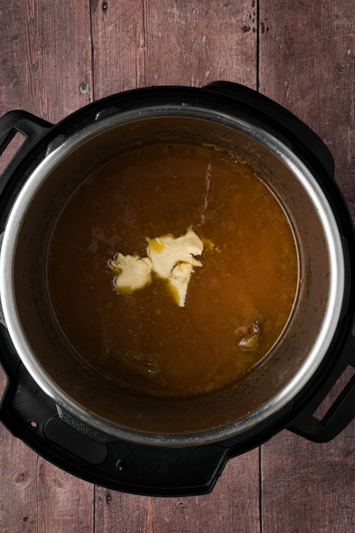 Butter paste mixture added to the Instant Pot.