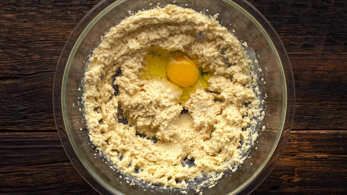 Egg added into the cake batter.