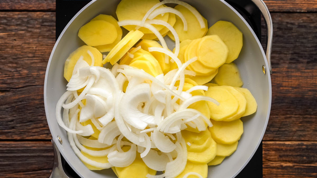Potatoes and onions in a skillet.