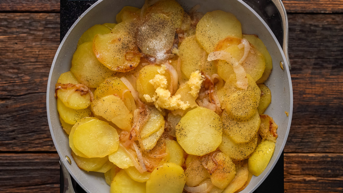 Spices added into the skillet.