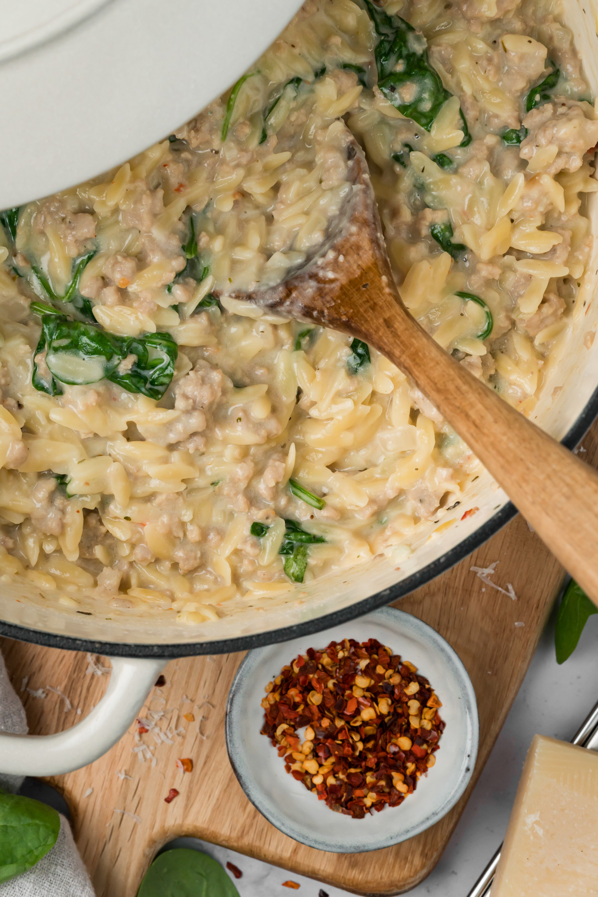 Sausage orzo in a Dutch oven.