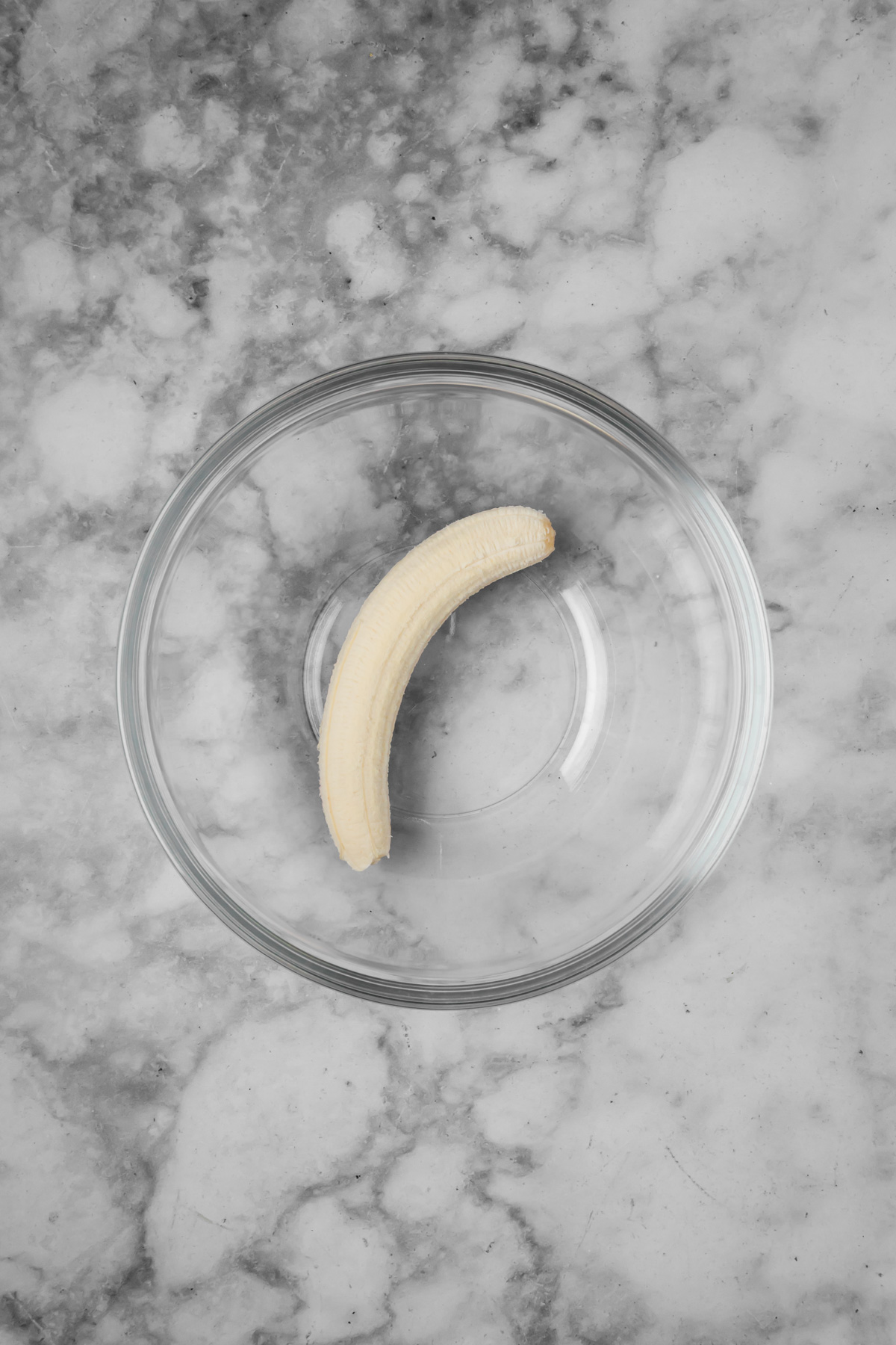 Banana in a glass bowl.