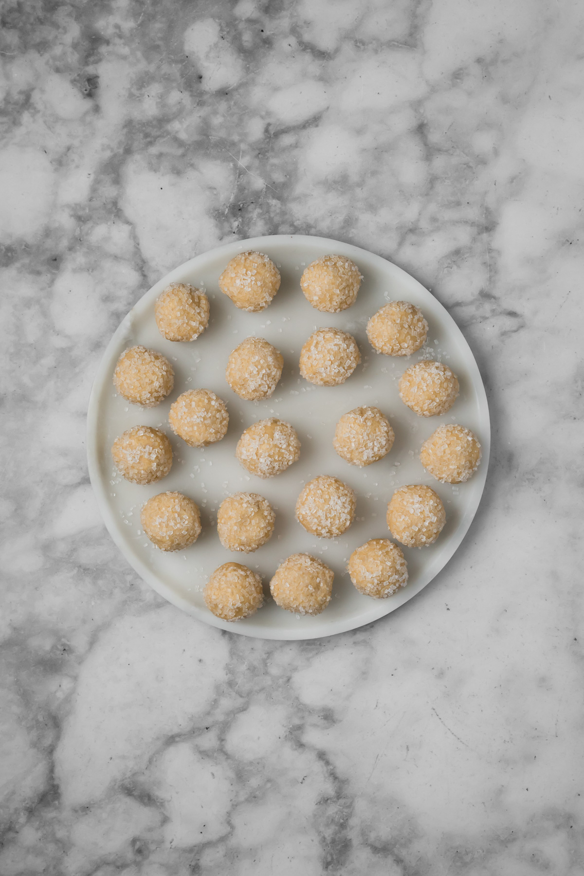 Cookie dough balls on a plate.