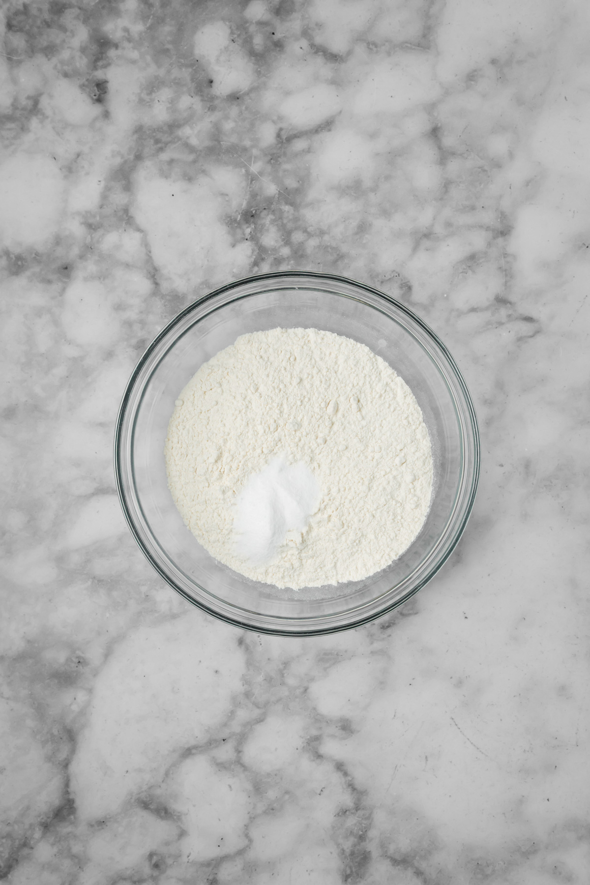 Dry ingredients in a glass bowl.
