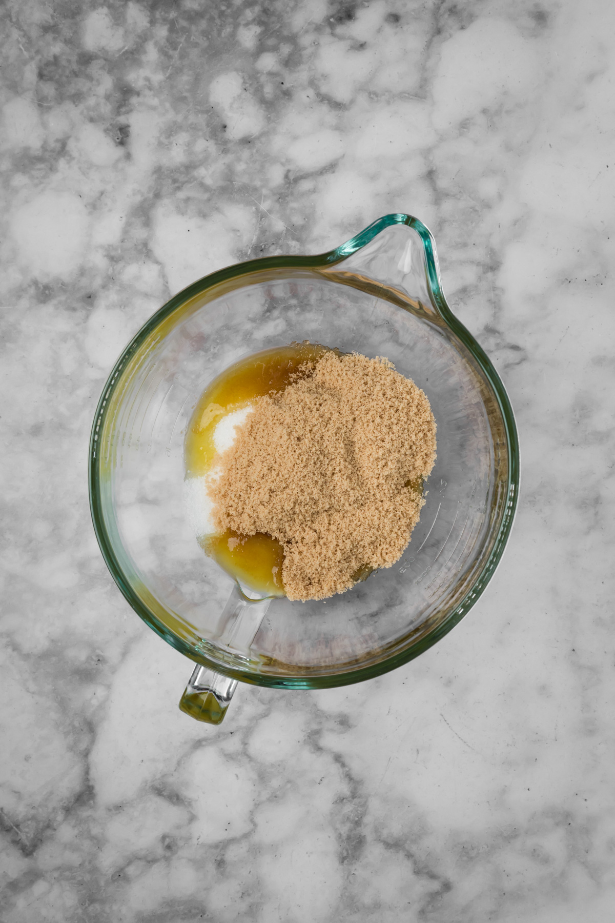 Butter and sugars in a mixing bowl.