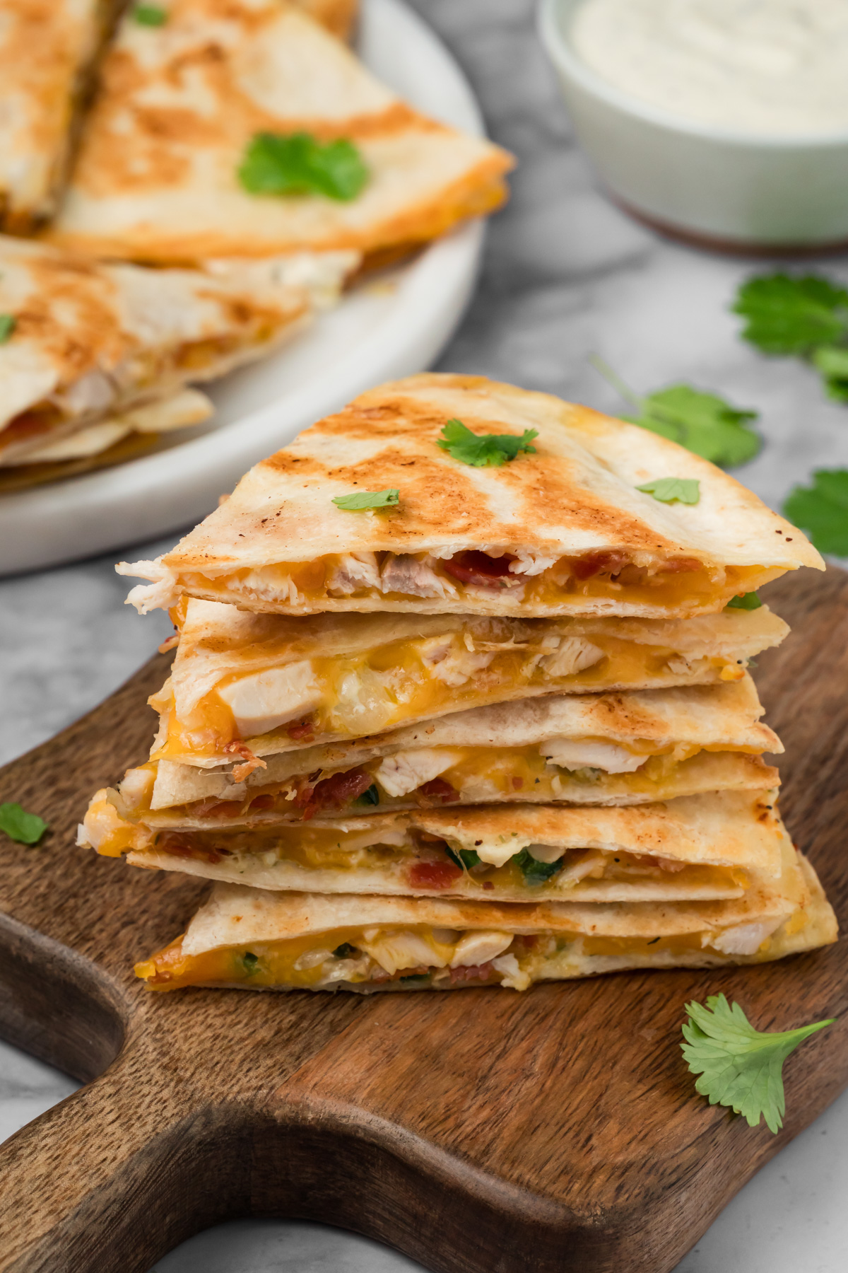 Quesadilla triangles stacked on top of each other.