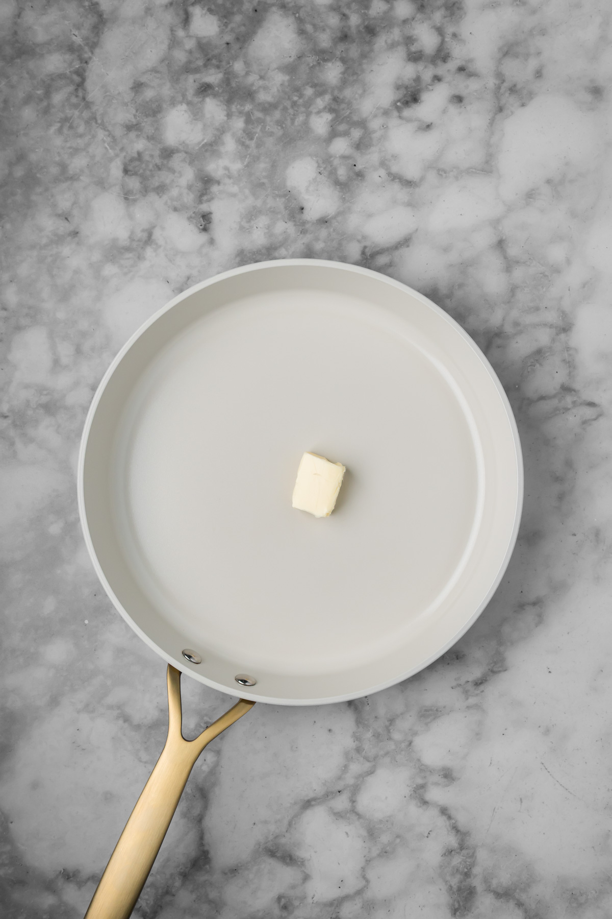 Butter in a pan.
