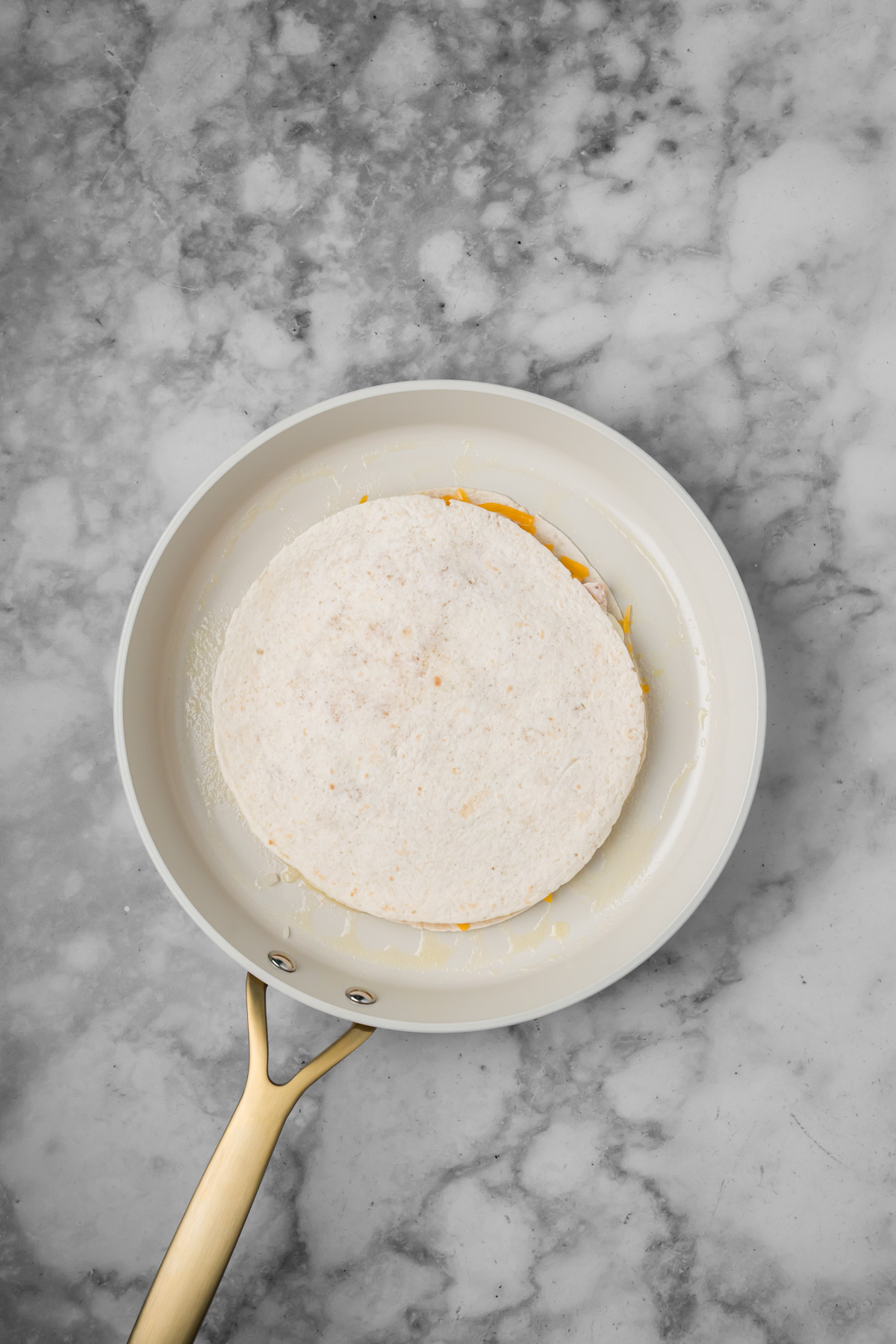 Tortilla added on top to create a quesadilla.