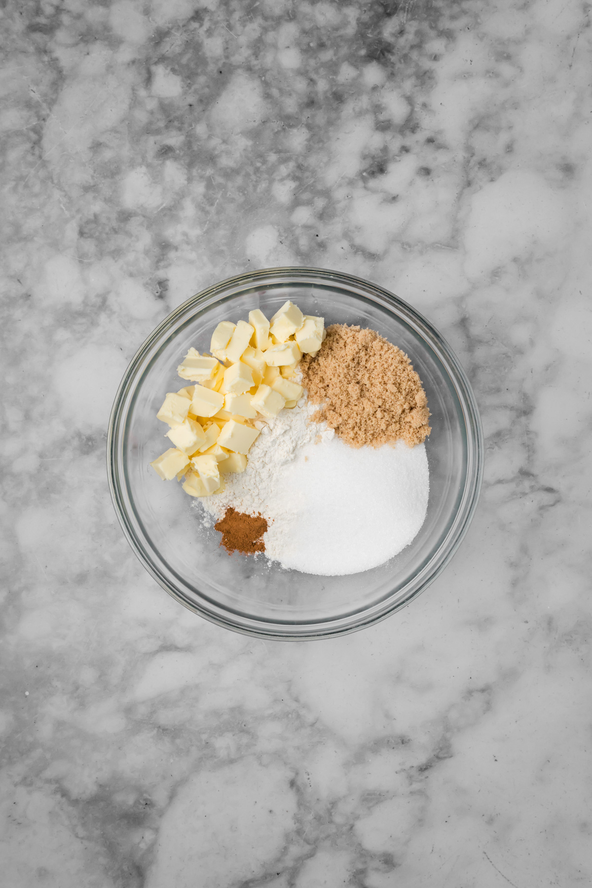 Crumble ingredients in a glass bowl.