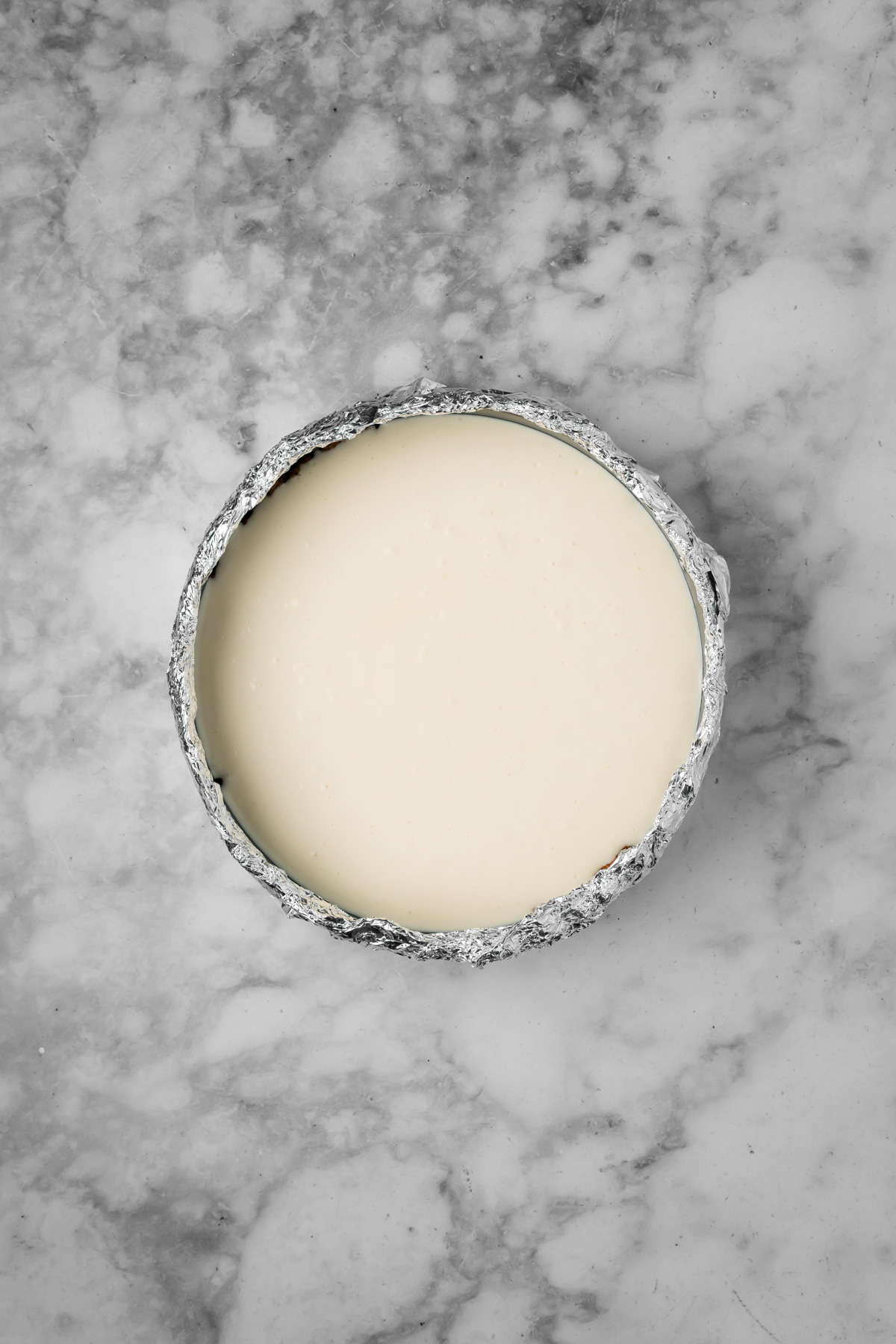 Cream cheese mixture added to the graham cracker crust.