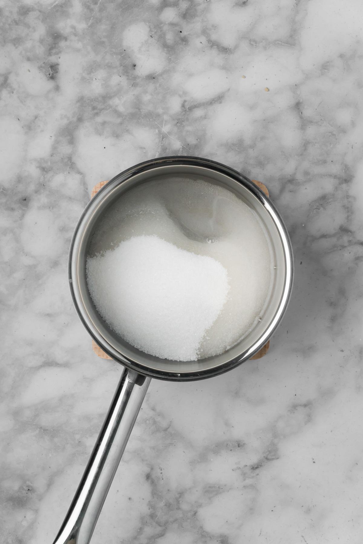 Water and sugar in a pot.