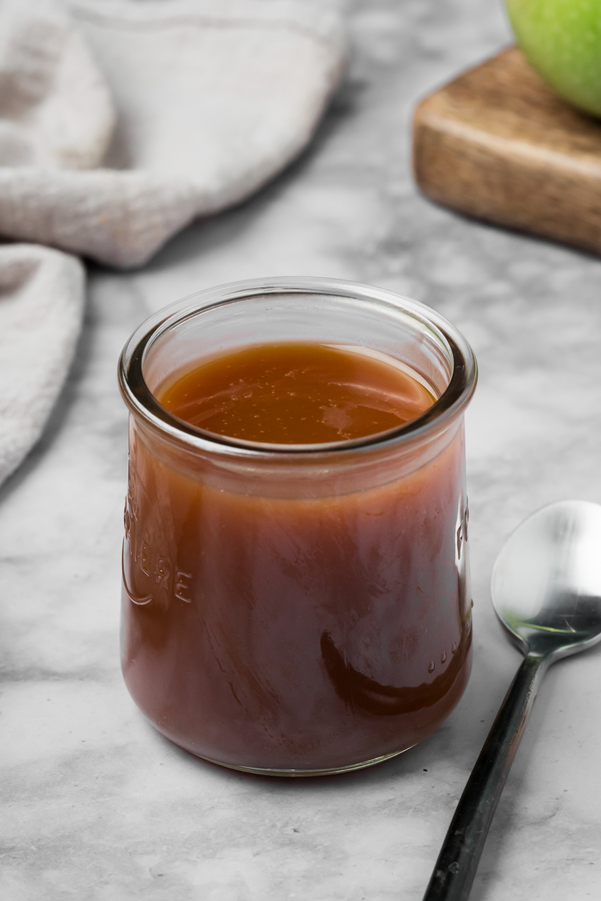 Caramel sauce in a glass jar.