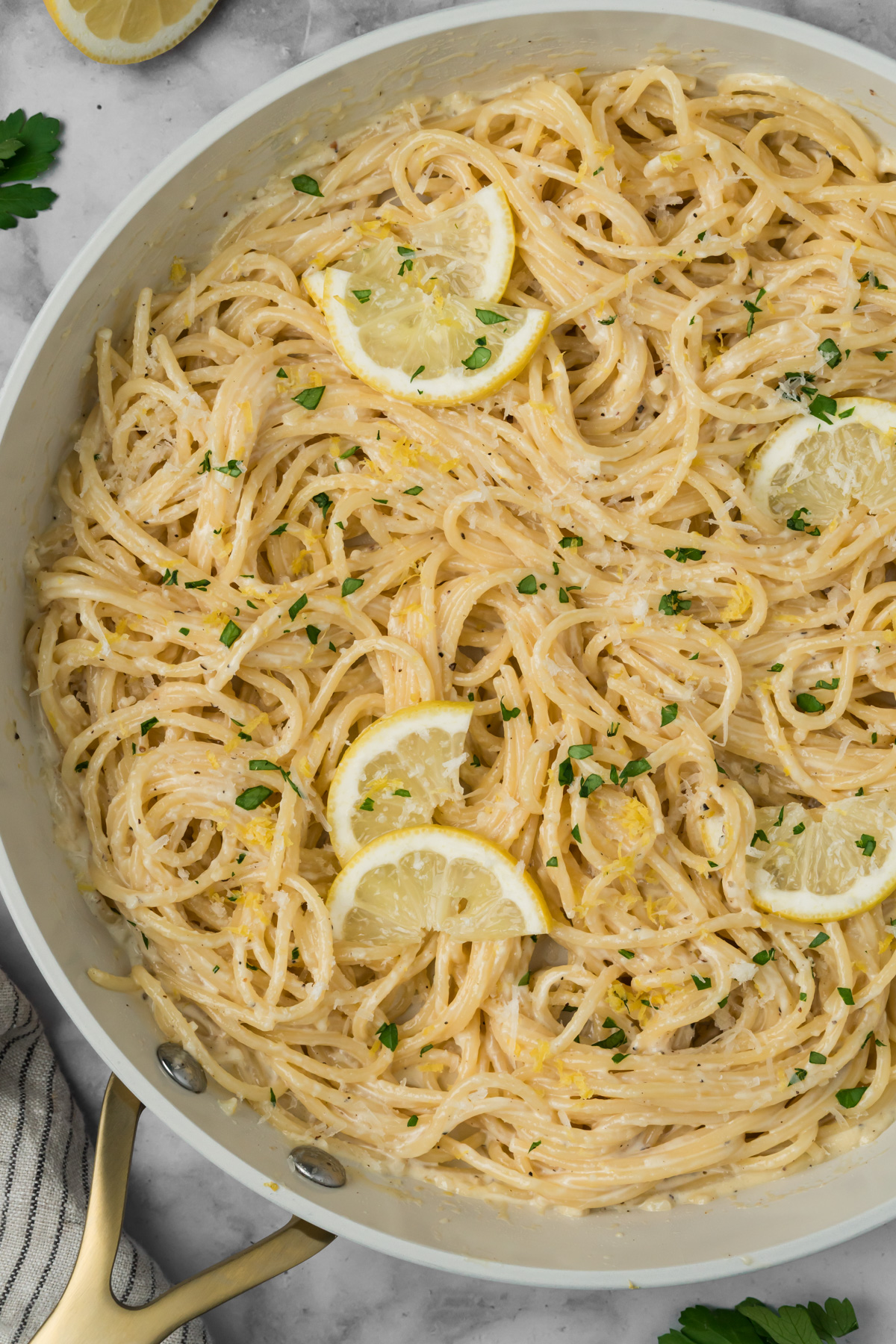 Pasta with lemon cream sauce in a pan.
