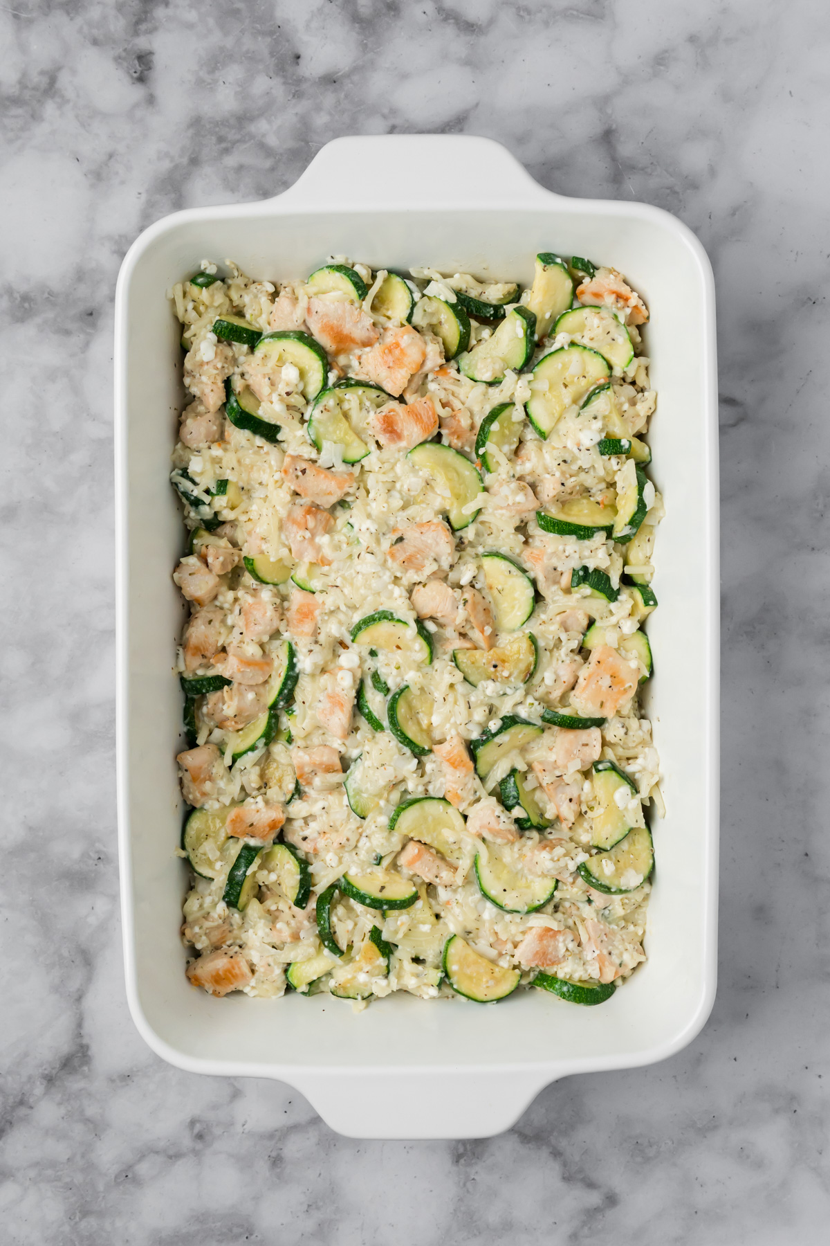 Chicken zucchini bake in a baking dish.