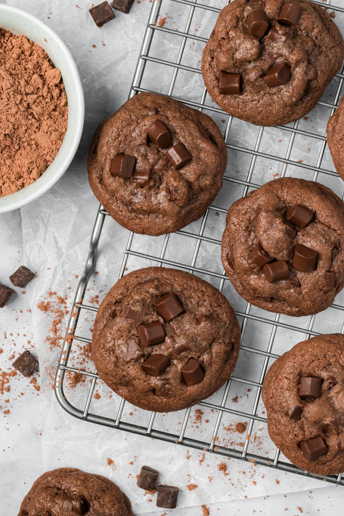 Dark chocolate cookies on a wire rack. 