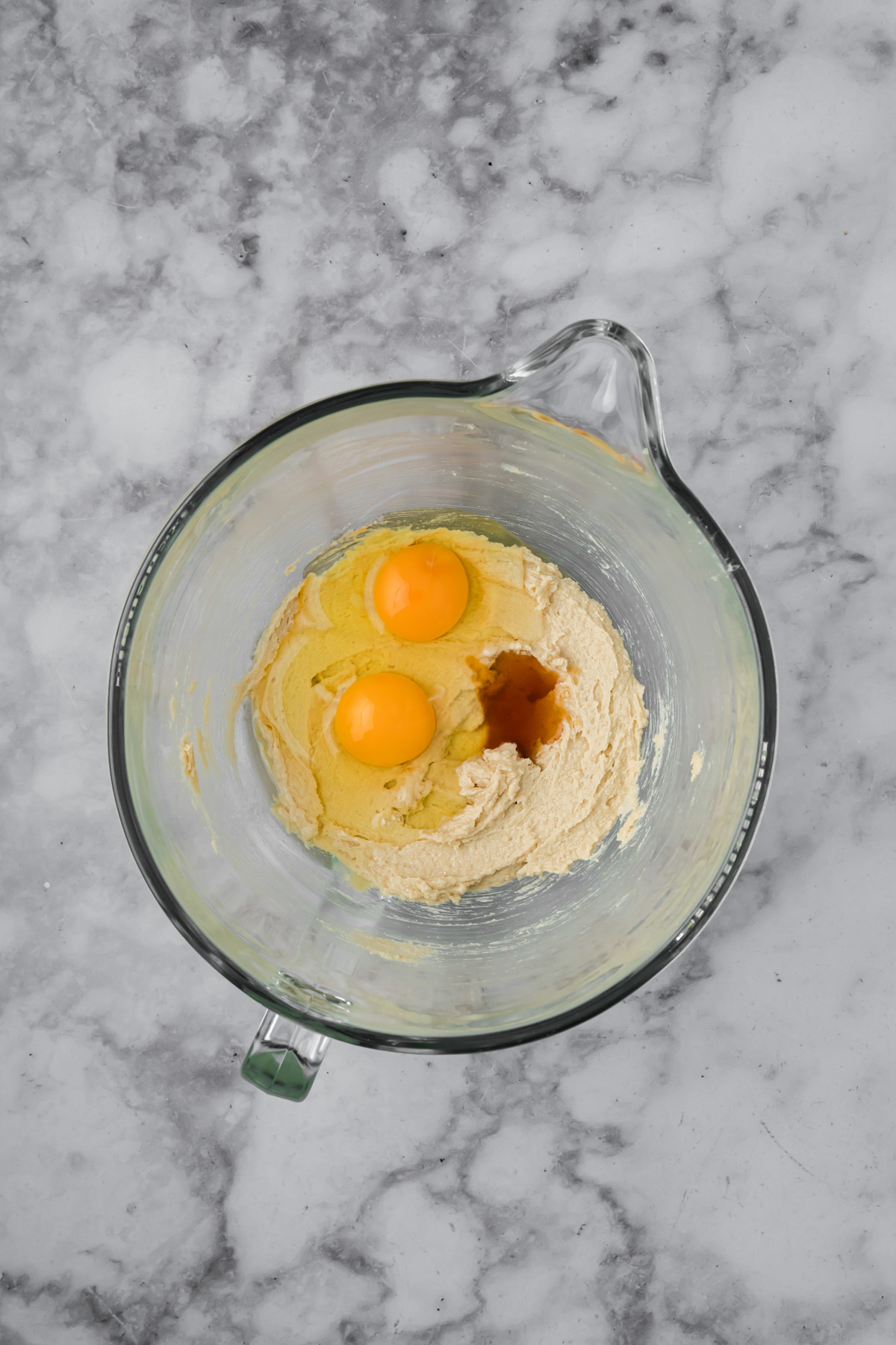Eggs and vanilla added to the mixing bowl. 