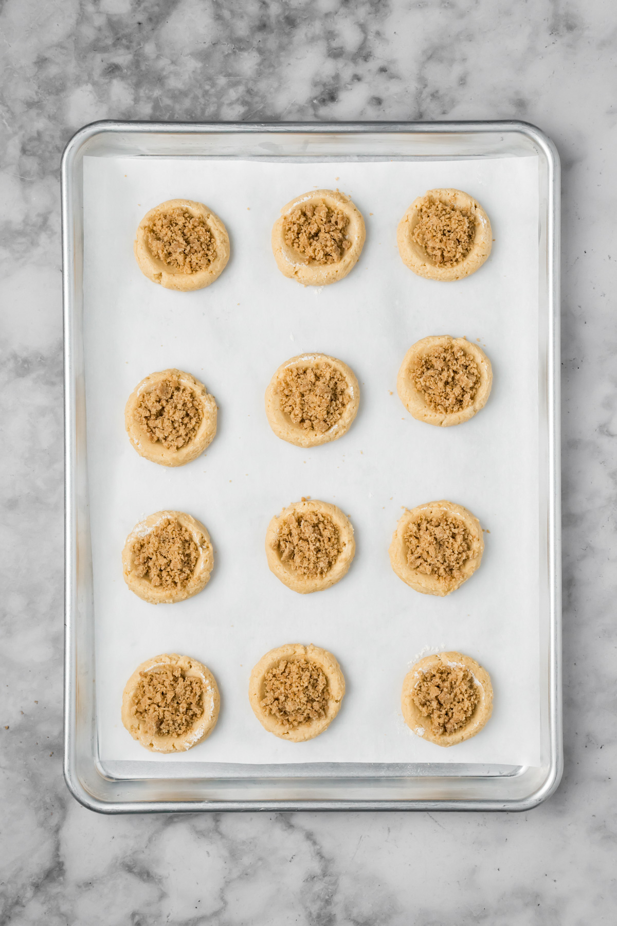 Cookie dough with crumble added to the middle before baking.