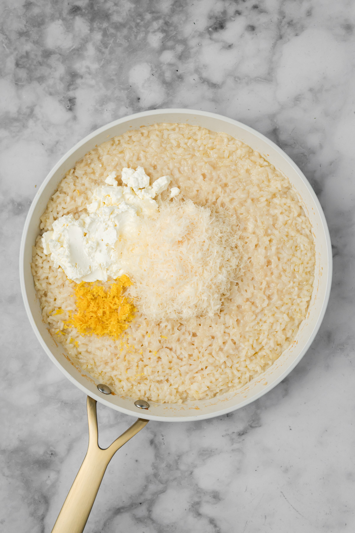 Lemon zest, lemon juice, mascarpone, and freshly grated parmesan cheese added to the risotto.