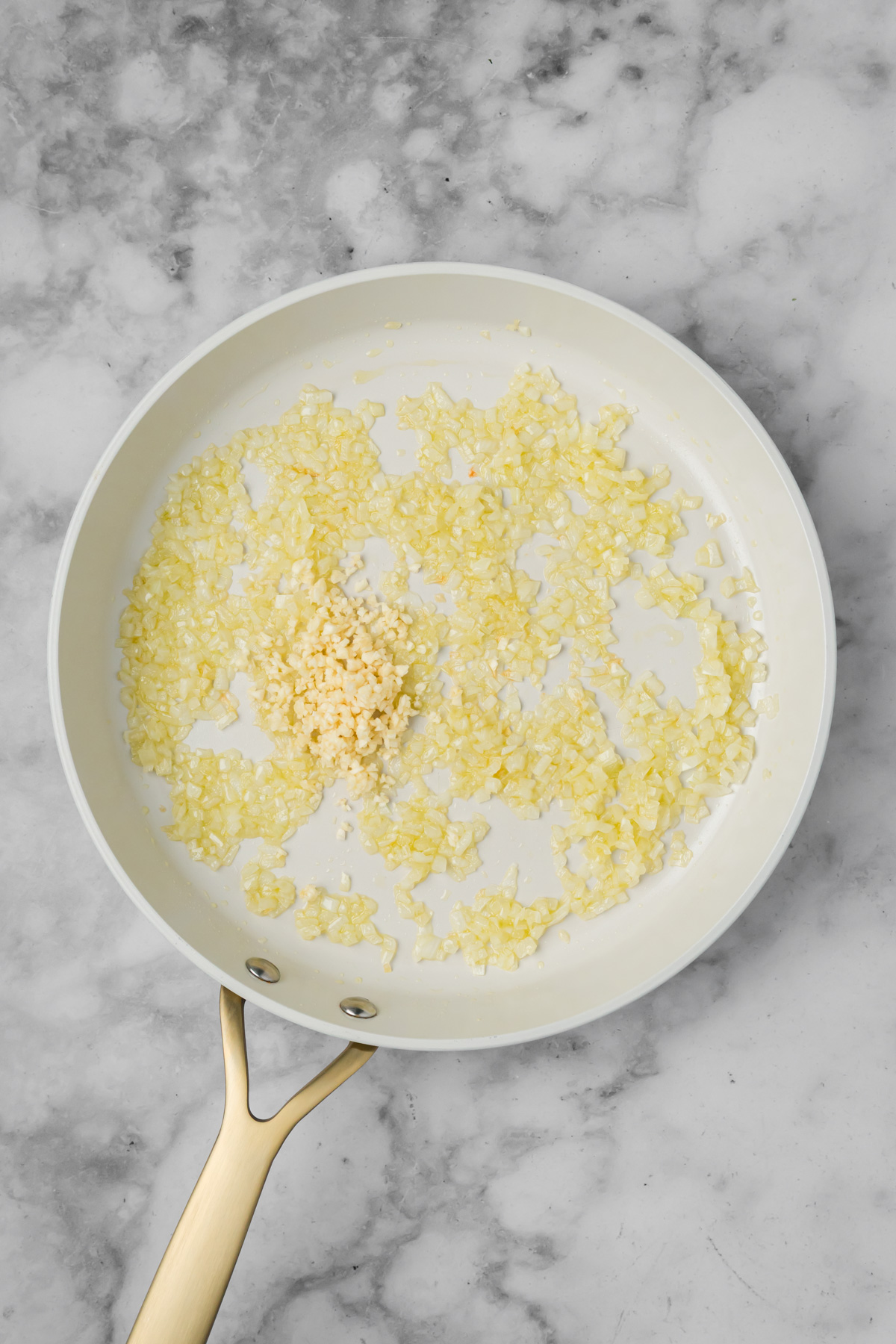 Garlic added to the skillet. 
